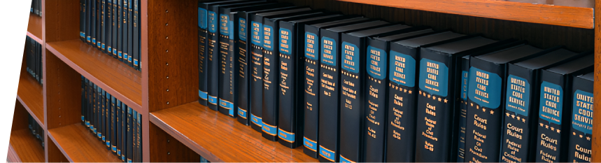 03 Law books on a wooden shelf.