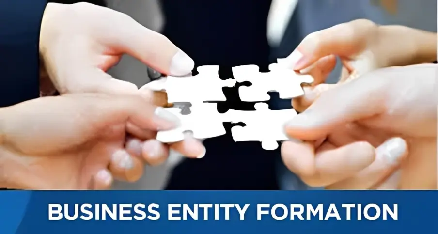 Hands joining puzzle pieces: business formation.